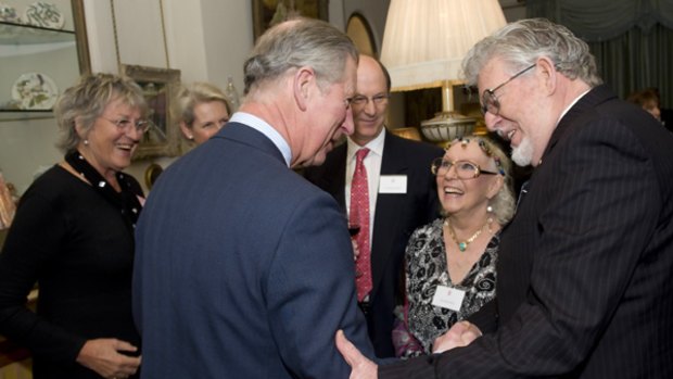 Germaine Greer, left, has called Australian authorities arsonists at a function attended by Britain's Prince Charles, second left, and Rolf Harris, right.