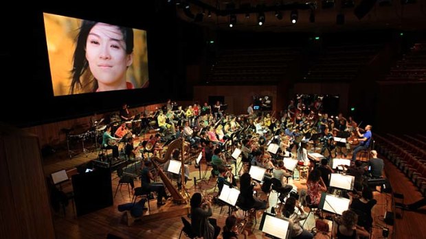 Films that accompanied the music ... the composer Tan Dun conducts the Sydney Symphony in rehearsal.