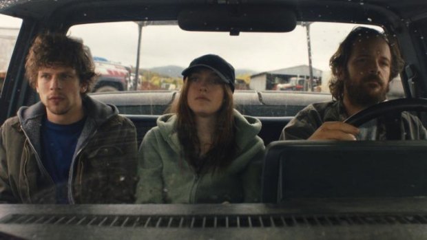 Jesse Eisenberg, Dakota Fanning and Peter Sarsgaard in a scene from <i>Night Moves</i>.