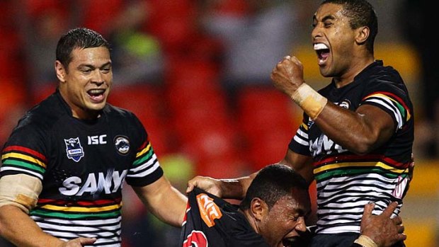 Happy days ... Michael Jennings, right, celebrates a Panthers try with Petero Civoniceva, with whom he will do battle in Origin 1.