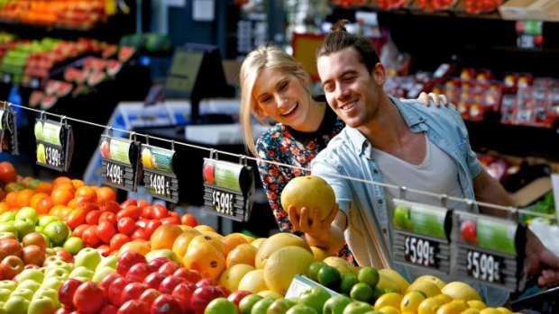 Master Chef winner Brent Owens with girlfriend Madison Ancrum at the Prahran Market. 