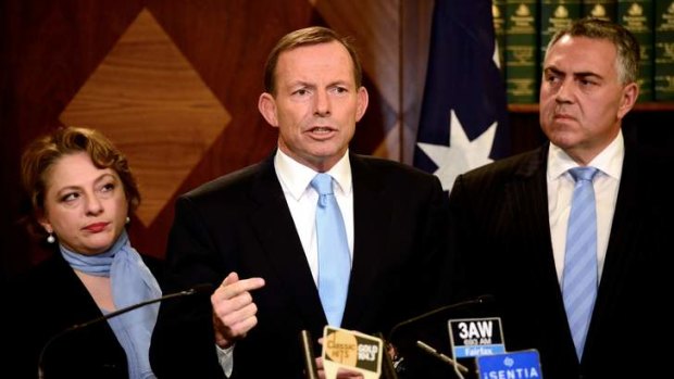 Opposition Leader Tony Abbott, with industry minister Sophie Mirabella and shadow treasurer Joe Hockey, has continued his attack on Kevin Rudd's PNG plan for asylum seeker policy.