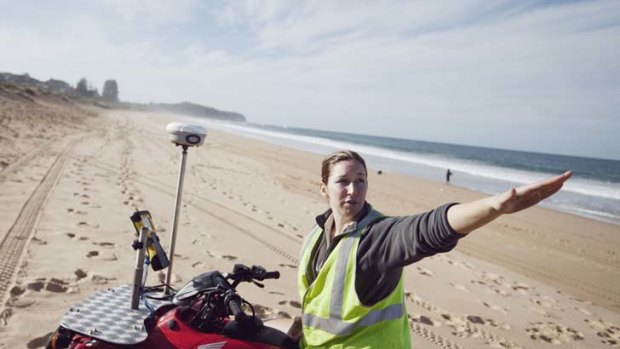 Location, location ...  Melissa Mole rides her quad bike on Narrabeen beach, plotting its fine structure at ground level as part of a sea-erosion study.
