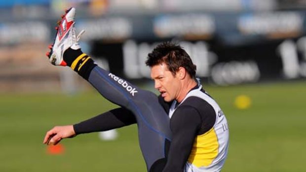 In full flight: Ben Cousins limbers up yesterday in a fitness test for his final game.