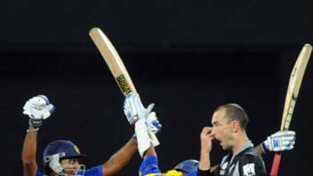 Sri Lankan batsmen Angelo Matthews and Thilan Samaraweera celebrate their victory.