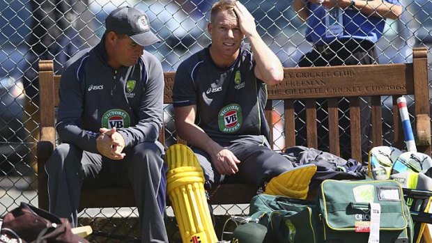 Headache: David Warner discusses his batting woes with Mickey Arthur during Australia's Ashes tour to England this year.