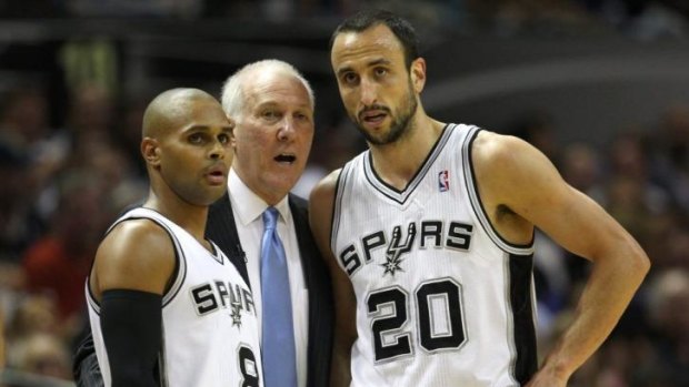 Patty Mills, left, with Spurs coach Gregg Popovich and Manu Ginobili.