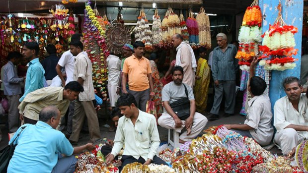 Taste of a nation ... shoppers stream through a New Delhi market.