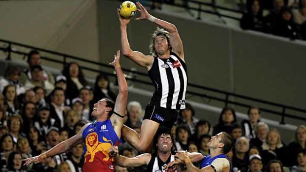 Dale Thomas soars for Collingwood during the 2011 AFL season.