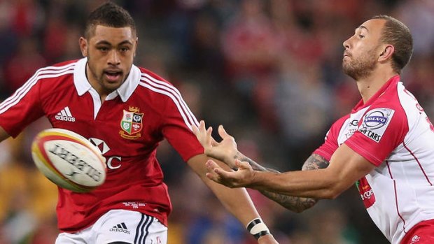 New chance: Quade Cooper (right) in action for the Reds against the Lions.