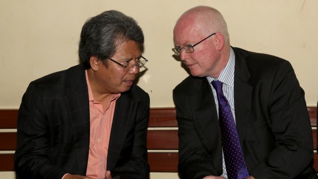 Todung Mulya Lubis, left, talks to Australian lawyer Julian McMahon before the Bali NIne legal challenge on Tuesday. 