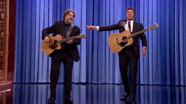 Russell Crowe and Jimmy Fallon sing 'Balls in your mouth' in a YouTube still from <i>The Tonight Show Starring Jimmy Fallon</i>