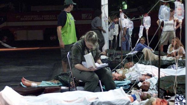 BALI  ... an Australian air force medic sits with injured Australians awaiting evacuation after the 2002 bombing.