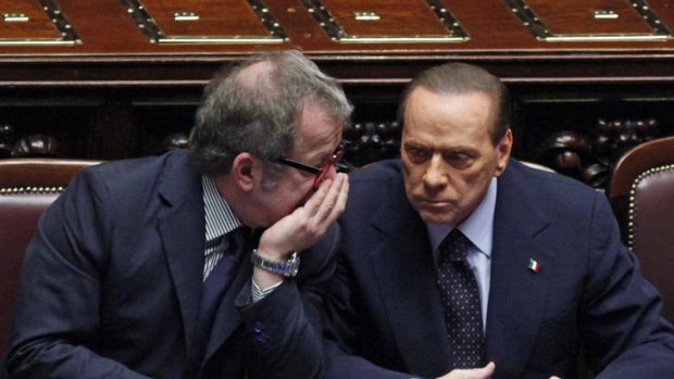 Silvio Berlusconi, right, and the interior minister, Roberto Maroni, during last night's vote.