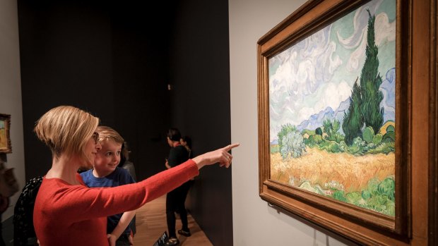 Jennifer Maxwell, pictured with her son Levi, 4, was the 150,000th visitor to Van Gogh and the Seasons at NGV International.