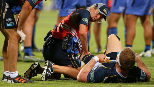 David Pocock receives medical attention to his knee during the round three Super Rugby match between the Western Force and the Brumbies in Perth.