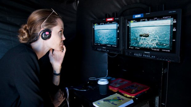 Angelina Jolie directs on the set of <i>Unbroken</i>.