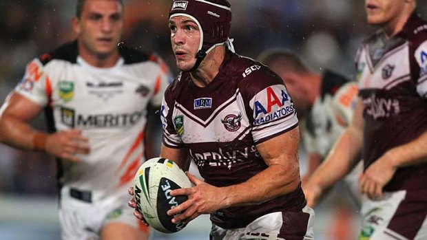 On song: Matt Ballin charges forward for Manly.