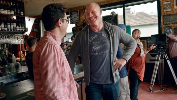 Producer Aiadan O'Bryan, left, and former AFL footballer Barry Hall chat between takes on the webseries <i>Four Quarters</i>.