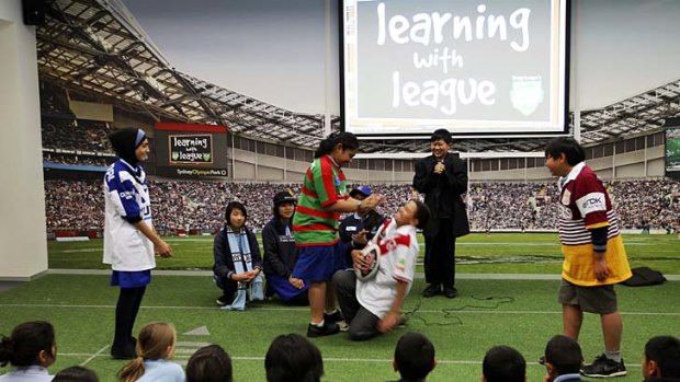 League lesson ... Lidcombe primary-school children role play at the NRL's new education centre in Moore Park.