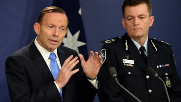 Australia's Prime Minister Tony Abbott speaks at a joint press conference with Australian Federal Police Commissioner Andrew Colvin in Sydney.