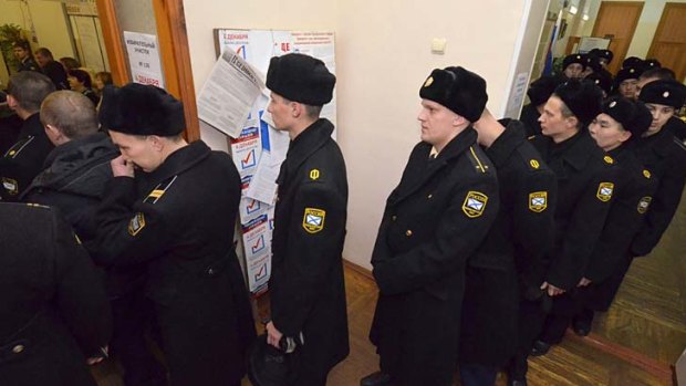Welcome aboard: Russian sailors line up to cast a vote in the far eastern port of Vladivostok.