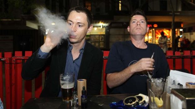 Recharging: Leon Alegria and Damian Duncan enjoy their electronic cigarettes at their local pub.