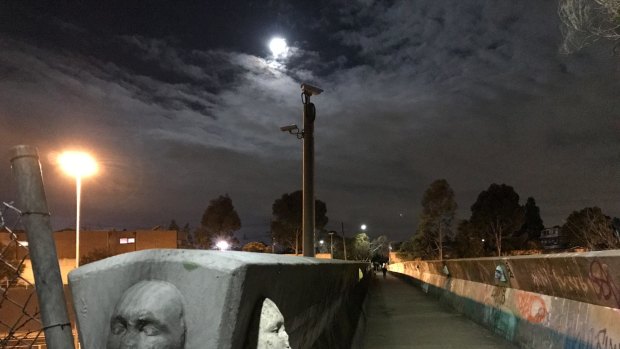 Brunswick's bridge of faces is especially creepy after dark.