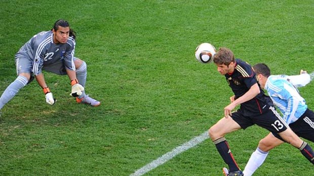 Early lead ... Thomas Mueller heads Germany in front.