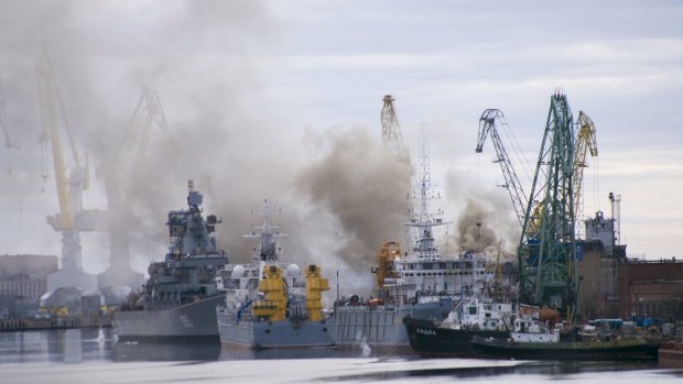Smoke rises above a dock at the Zvyozdochka shipyard in the north Russian city of Severodvinsk from a fire on a nuclear submarine in Russia's northern province of Arkhangelsk.