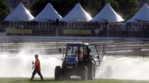 Course workers water the Flemington track in preparation for the Melbourne Cup in 2005.