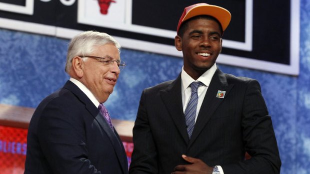 Top pick ... Australian Kyrie Irving poses with NBA Commissioner David Stern.