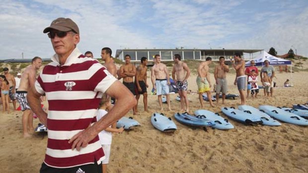 Enjoy the sun while you can . . .  Dragons coach Wayne Bennett supervises his squad in a cross-training drill at Elouera Beach yesterday in preparation for their trip to England for the World Club Challenge.