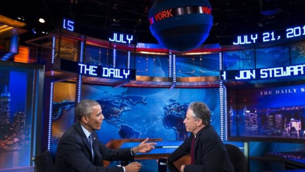 US President Barack Obama, left, talks with Jon Stewart in July.