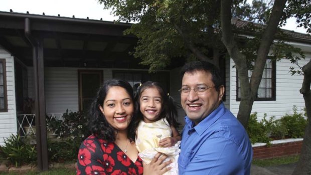 Happy &#8230; Ramya and Jayakumar Menon, with daughter Nikita. The couple refinanced with a credit union.