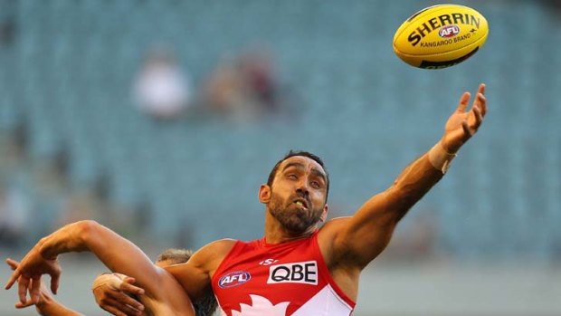 At a stretch &#8230; Adam Goodes of the Swans reaches for the ball in round one of the NAB Cup against St Kilda.