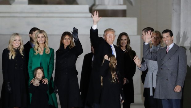 President-elect Donald Trump, his wife Melania Trump and family wave at the conclusion of the pre-Inaugural "Make America Great Again! Welcome Celebration".
