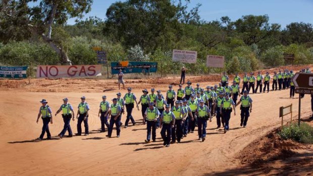 Over 150 police officers were sent to WA's north as tensions mount at gas hub site.