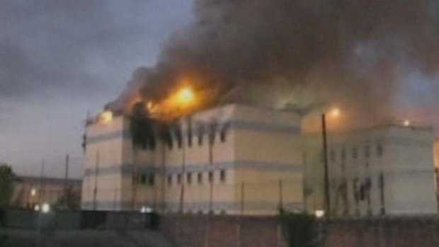 Scores dead .... fire rips through a Chilean prison.
