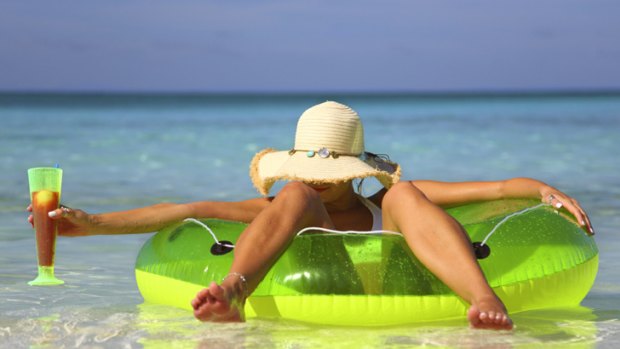 Generic summer pic, woman on a floatie at the beach, pool, swimming, holidays, relaxing.