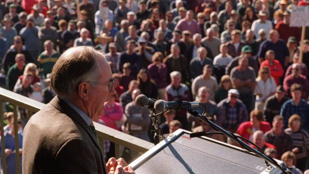 Protection: John Howard wears a bullet-proof vest under his jacket during a rally about gun laws in Sale, Victoria, in 1996.