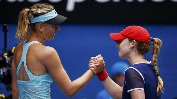 Mismatch: Maria Sharapova of Russia shakes hands with Alize Cornet of France her win.