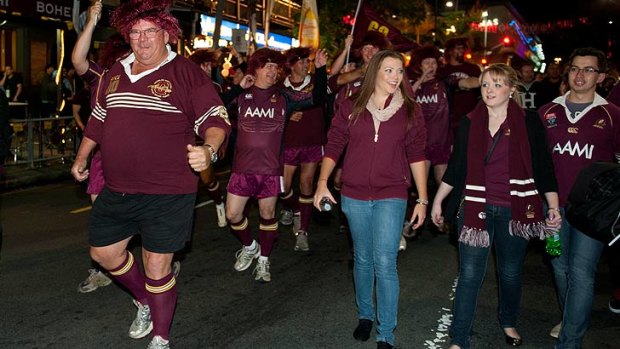 The Maroon army marches down Caxton Street to Suncorp Stadium.