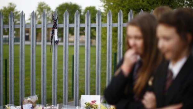 A school tie hangs from the fence of Corpus Christi Catholic.