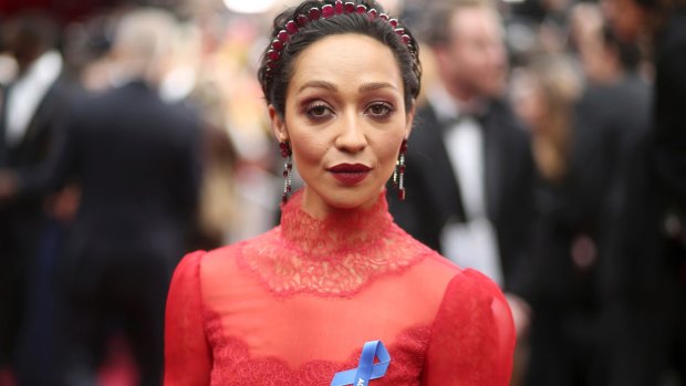 Ruth Negga, wearing the ACLU ribbon, arrives at the Oscars on Sunday, Feb. 26, 2017, at the Dolby Theatre in Los Angeles. (Photo by Matt Sayles/Invision/AP)