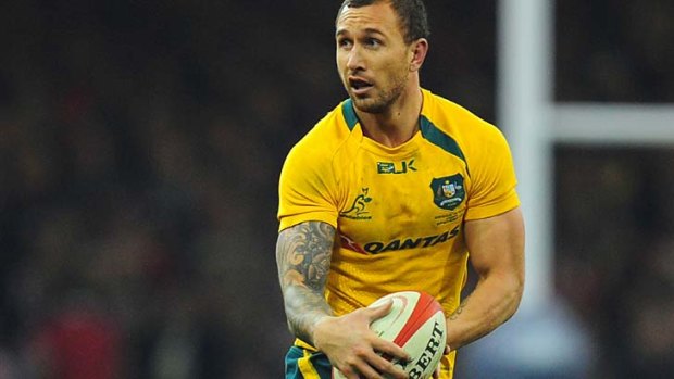 Man of the match: Quade Cooper makes a break for the Wallabies.