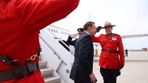 Prime Minister Tony Abbott pictued arriving in Ottowa, Canada on Sunday.