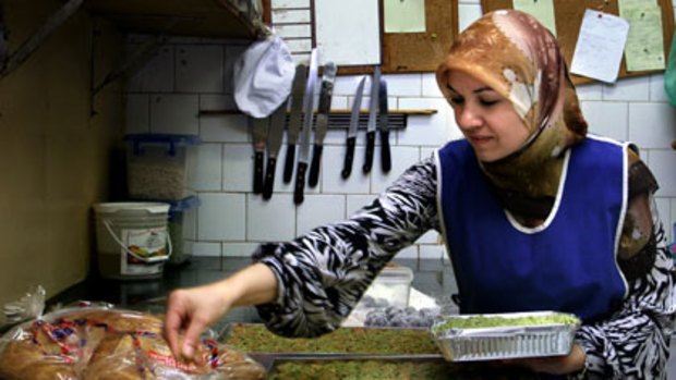Busy ... Nermin Gunduz prepares Turkish delicacies.