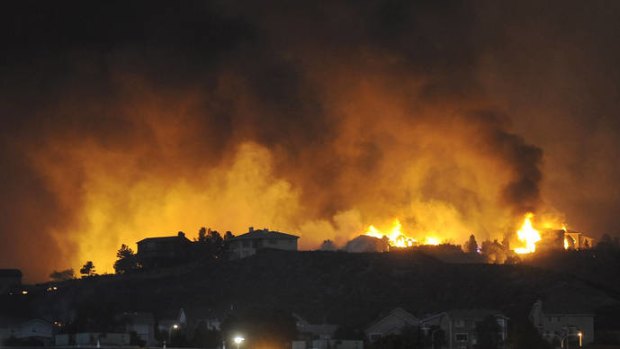 Fire reaches houses in the Mountain Shadows area of Colorado Springs.
