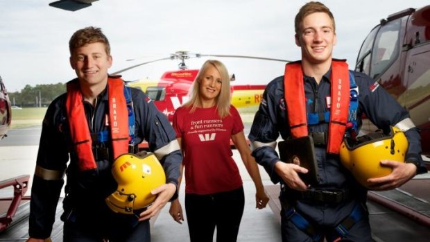 Westpac rescue helicopter crewmen Ashley Baxter and Brendan Smart with Sue Pappas.